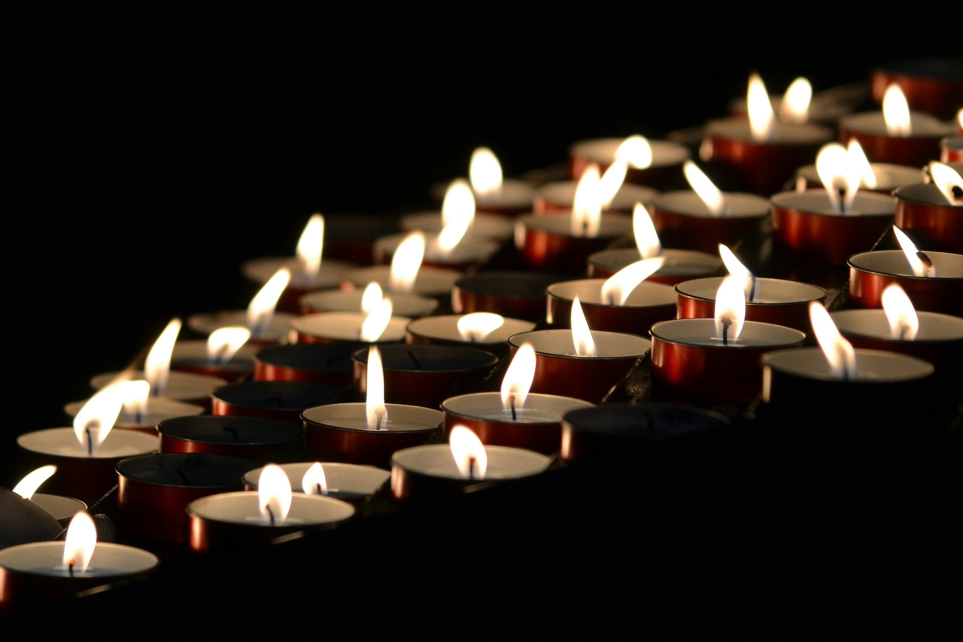 rows of lit tea lights